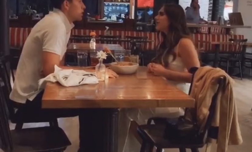 Angry girlfriend throws food at boyfriend