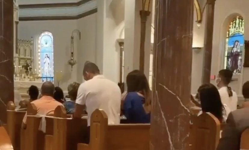 Man caught multitasking while at church service