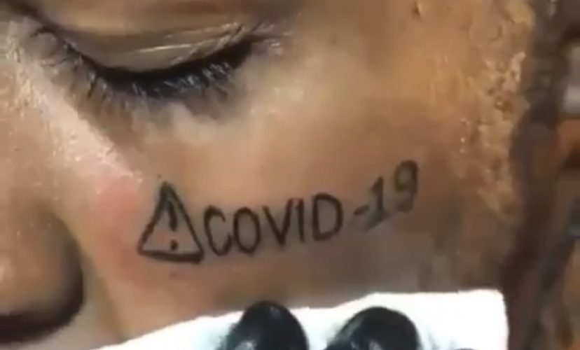 Man gets a COVID-19 tattoo
