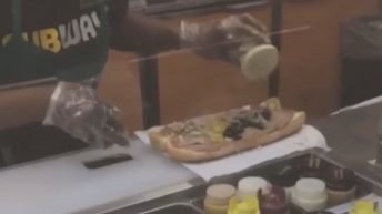 Subway worker slumps while making sandwich