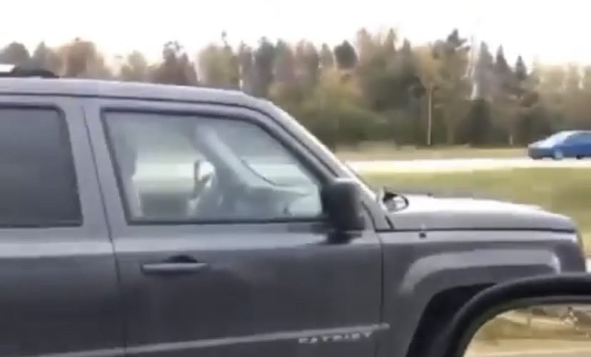 Woman drives car on bare rim