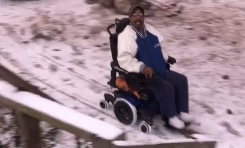Uncle Tee flies in his electric wheelchair