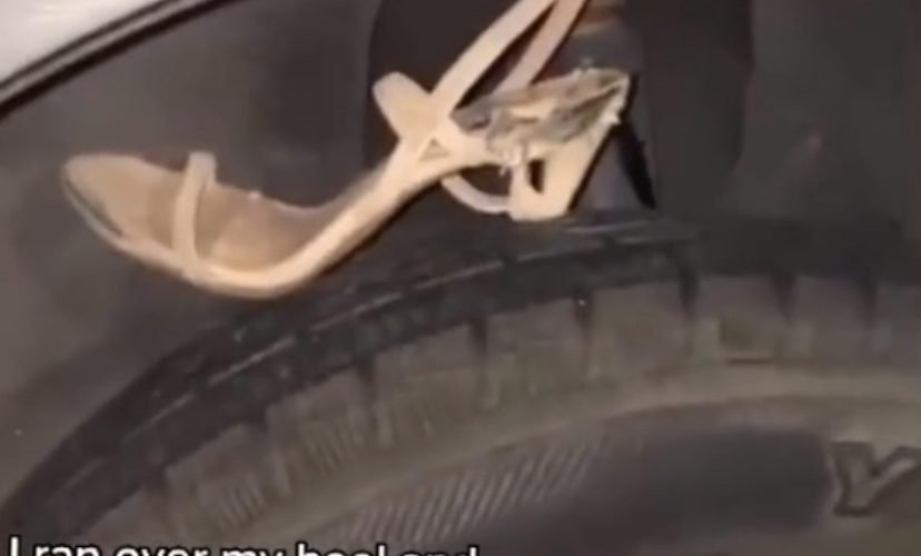 Woman heel punctures tire