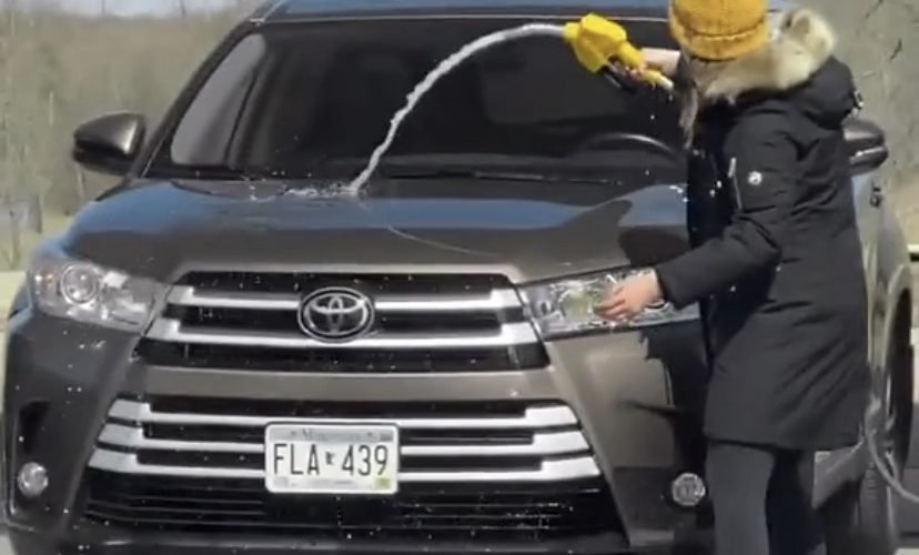 Woman washes car with gasoline