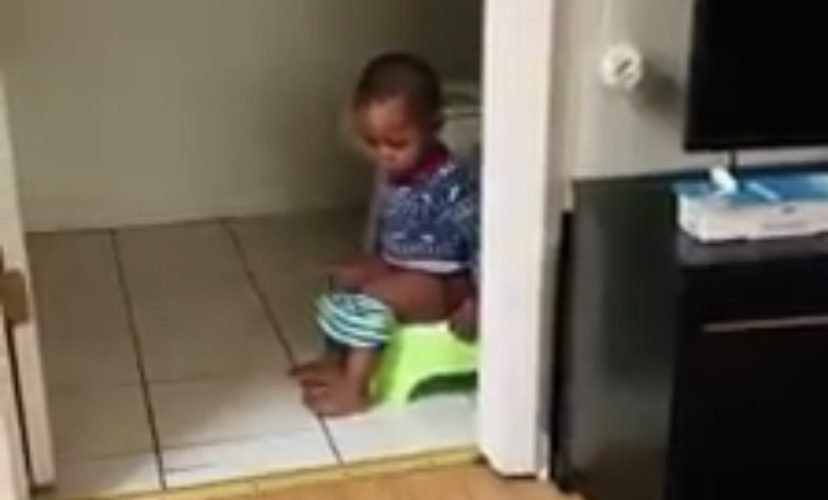 Toddler pees in floor while using potty chair