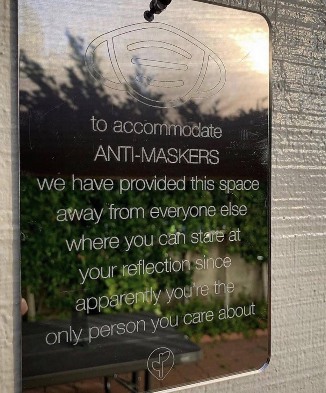 To accommodate anti-maskers we have provided this space away from everyone else where you can stare at your reflection since apparently you're the only person you care about sign