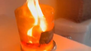 Woman's candle turns into a flame