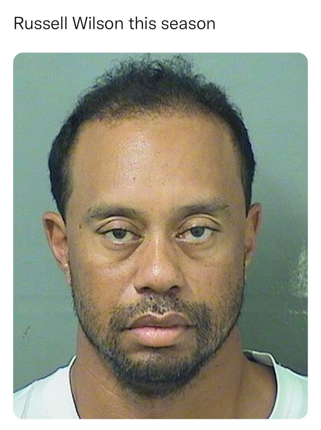 Russell Wilson this season Tiger Woods mugshot meme