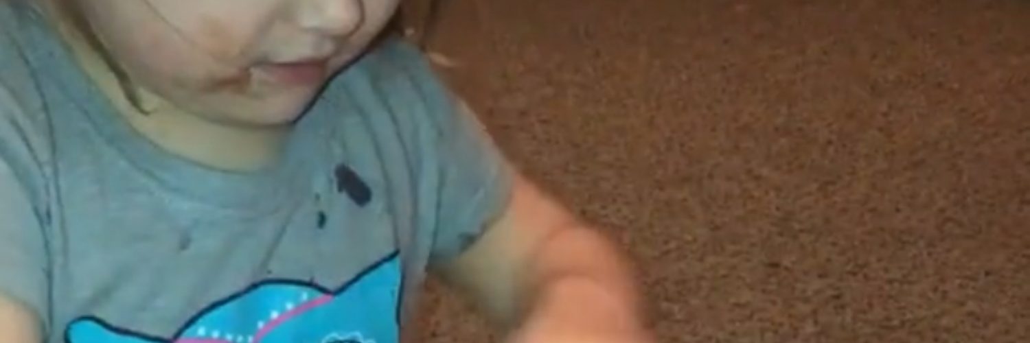 Excited toddler curses while opening presents
