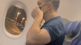 Man puts on multiple masks before flight