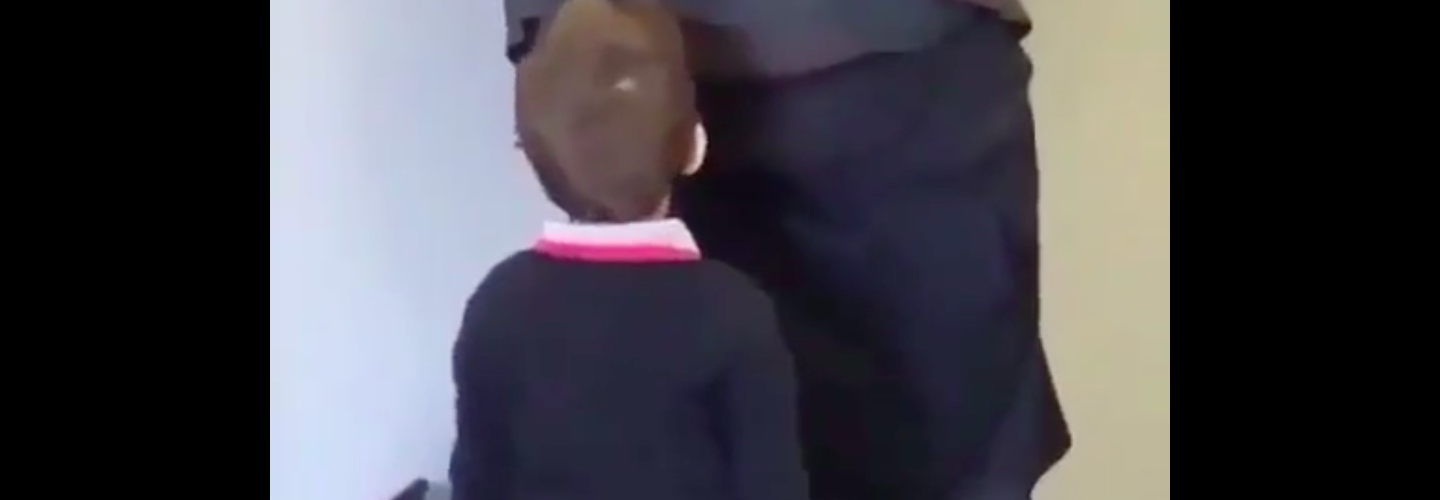 Curious child stares into man's butt
