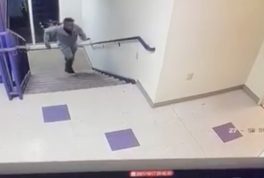 Man drops food while walking up stairs
