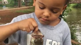 Fish scares boy while fishing