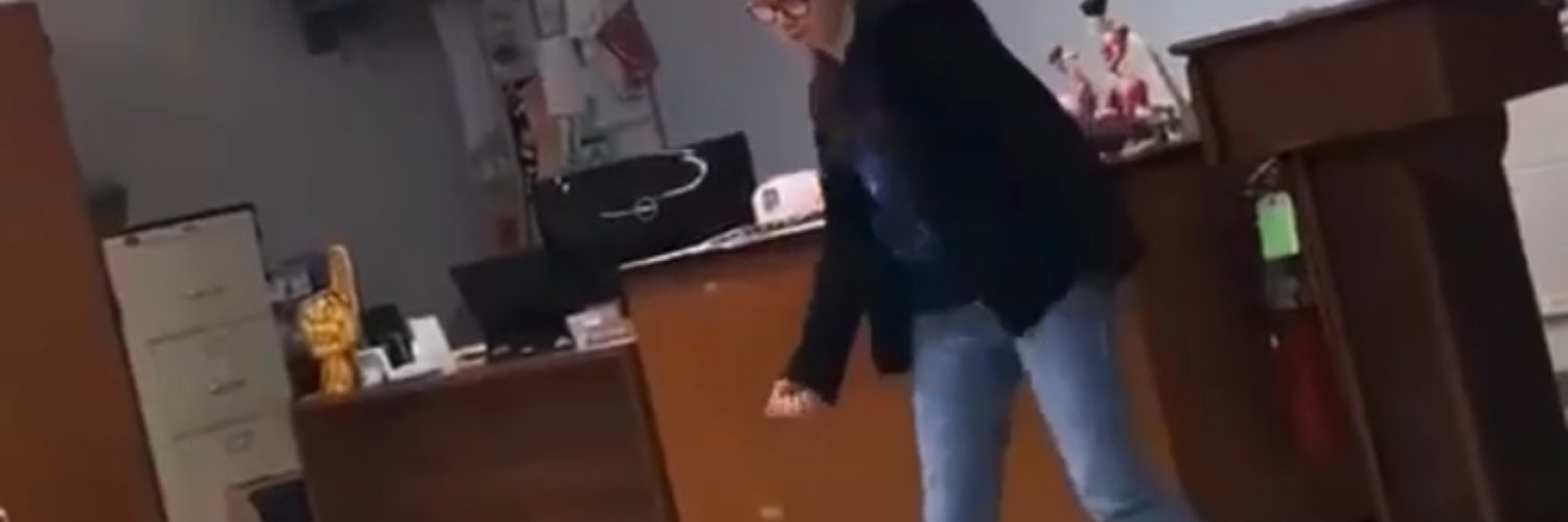 Girl dances in front of class