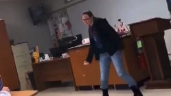 Girl dances in front of class